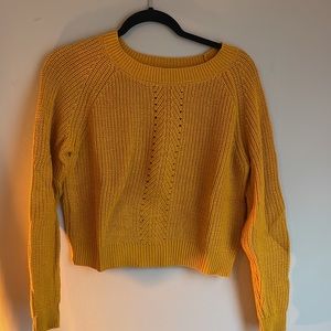 2 sweaters orange and green